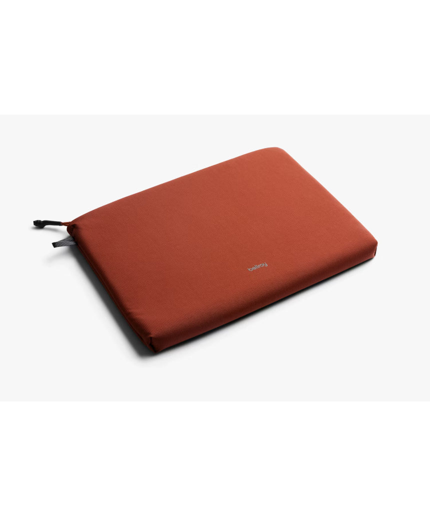 Bellroy Lite 14-inch Clay laptop sleeve showing a slim, padded design with a smooth clay-colored exterior and clean stitching.