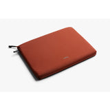 Bellroy Lite Laptop Sleeve 14 inch in clay color, slim protective case with smooth fabric exterior for MacBook or similar laptops.