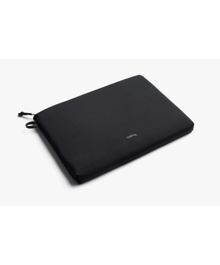 Black Bellroy Lite Laptop Sleeve for 16-inch laptops, slim protective case with smooth exterior and minimalist design.