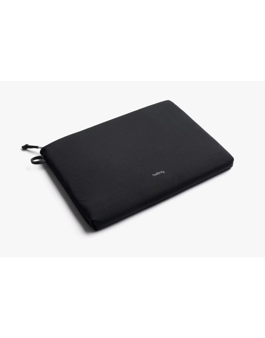 Black Bellroy Lite Laptop Sleeve for 16-inch laptops, slim protective case with smooth exterior and minimalist design.