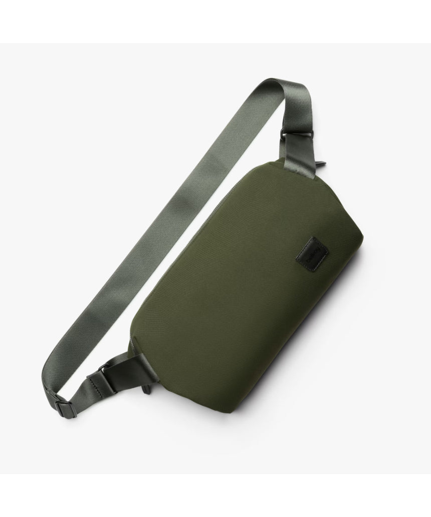Bellroy Classic Sling 7L in olive color, showing compact urban crossbody bag with adjustable strap and sleek design.