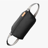 Bellroy sling bag in slate color with adjustable strap, compact design, and multiple pockets for everyday carry.
