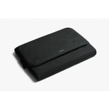 Black Bellroy Laptop Caddy for 14-inch laptops, featuring organized compartments and sleek design.