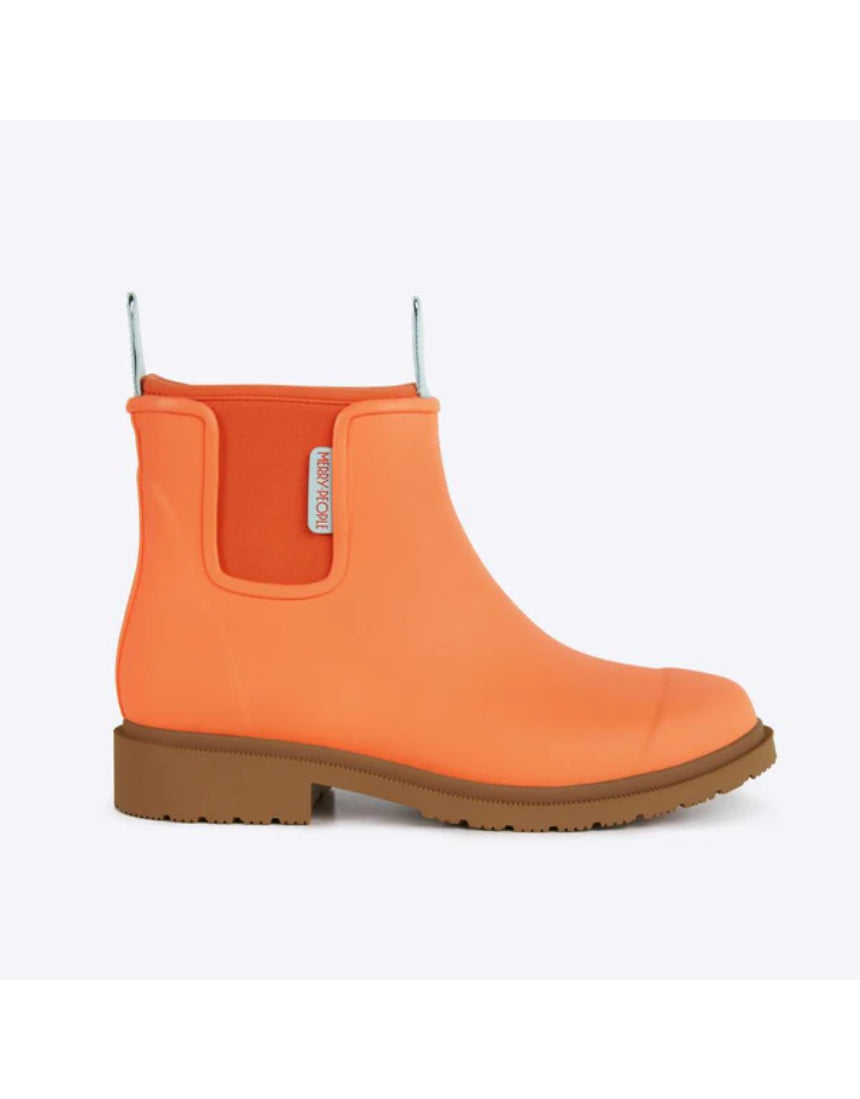 Orange Merry People Bobbi gumboots with Sherbet hue, shown from the side, durable waterproof footwear for rainy weather.