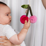 Living Textiles stroller toys featuring a colorful pineapple and cherries, soft fabric, and hanging loop for baby entertainment.