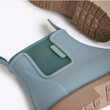 Close-up of Merry People Bobbi Gumboots in seafoam green, showcasing the waterproof rubber material and stylish design.