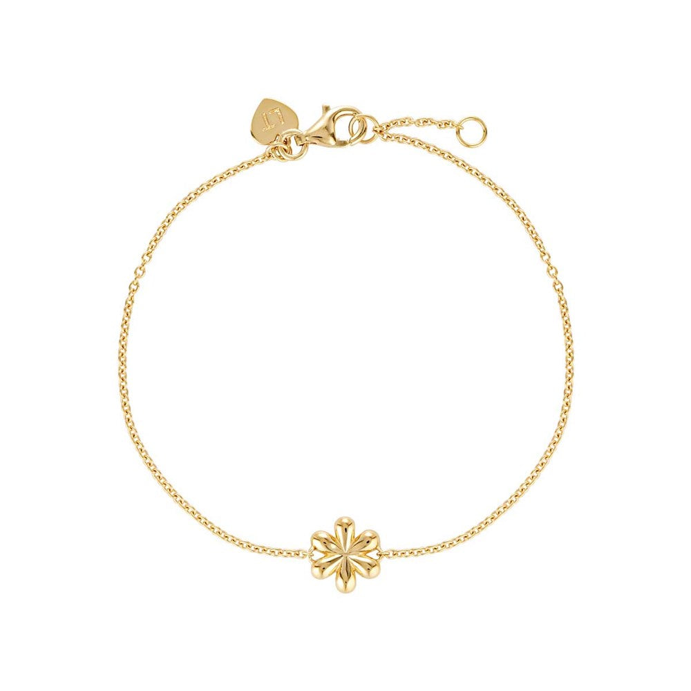 Linda Tahija Daisy bracelet with delicate gold-tone chain and floral charm, showcasing elegant jewelry design.