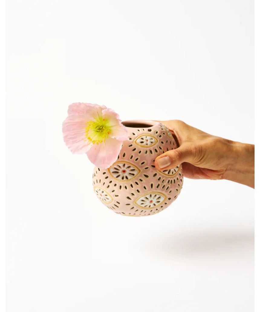 Jones & Co Pollen Vase in pink with eye design, featuring a sleek, modern ceramic vase perfect for floral arrangements.