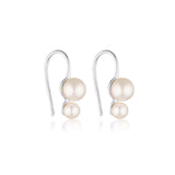 Linda Tahija double pearl drop earrings featuring elegant hooks and two white pearls on shiny silver hooks.