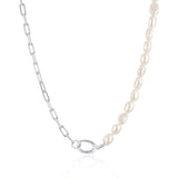 Linda Tahija paperclip necklace with baroque pearl accents, showcasing a stylish and elegant jewelry piece.