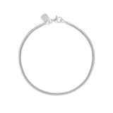 Linda Tahija fluid snake chain bracelet featuring a sleek, shiny silver design with a smooth, flexible texture.