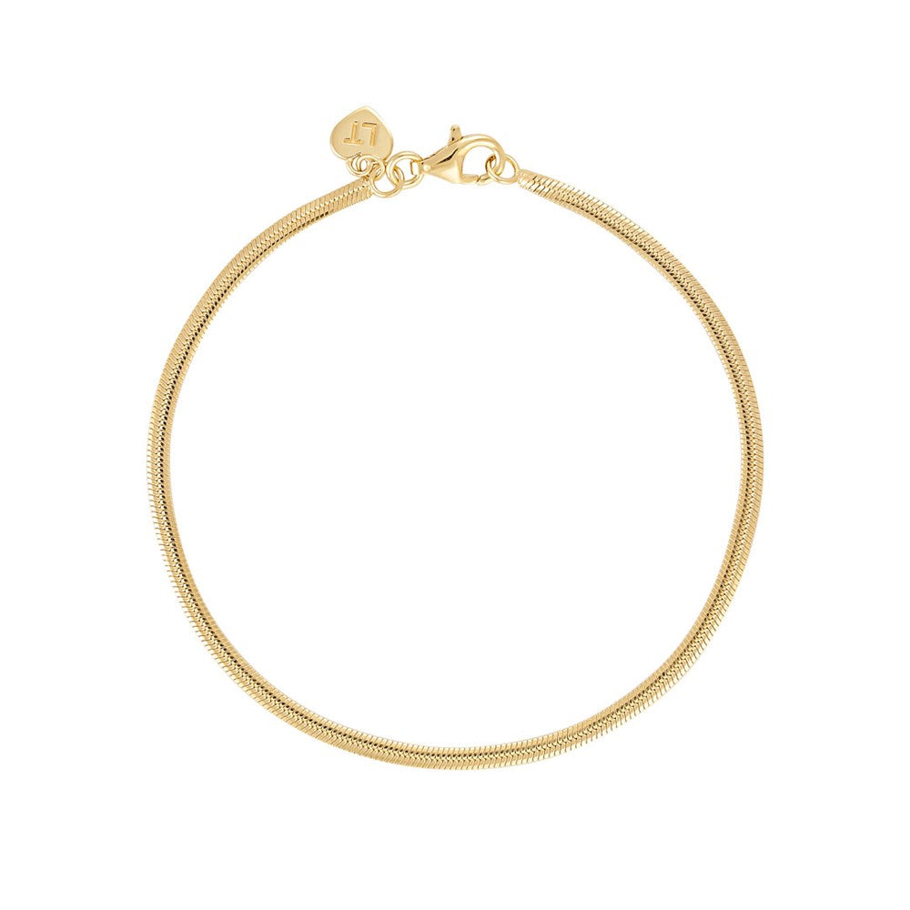 Linda Tahija fluid snake chain bracelet featuring a sleek, shiny gold finish and smooth, interconnected links.