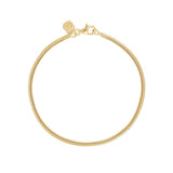 Linda Tahija fluid snake chain bracelet featuring a sleek, shiny gold finish and smooth, interconnected links.
