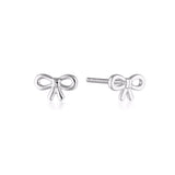 Linda Tahija bow stud earrings, gold-tone jewelry with delicate bow design, small and stylish for everyday wear