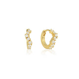 Linda Tahija Ebb Huggie earrings with lab-grown sapphire stones, featuring a sleek gold-tone design and secure hinge closure.