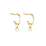 Linda Tahija pearl charm hoop earrings featuring gold base hoops with elegant pearl accents on a white background.