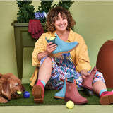 Seafoam Merry People Bobbi gumboots shown in a lifestyle scene, featuring waterproof rubber footwear with a casual, stylish design.