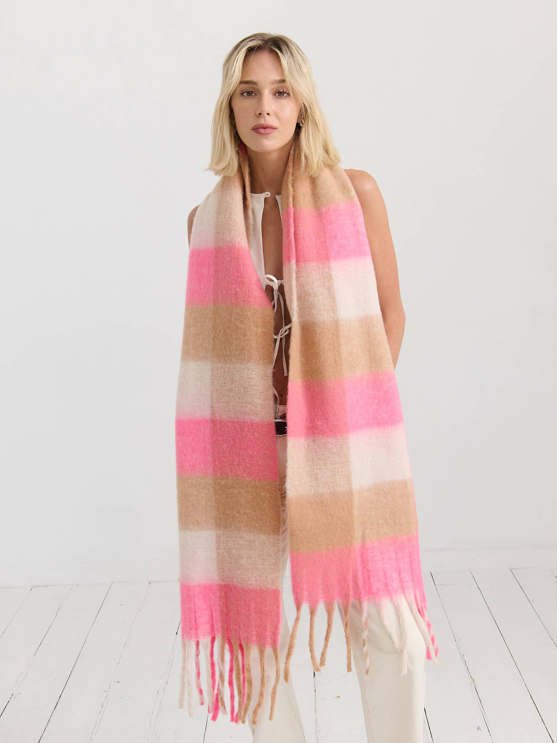 Neon pink checkered fluffy scarf by Angels Whisper Accessories, soft and cozy with a vibrant pattern perfect for stylish winter wear.
