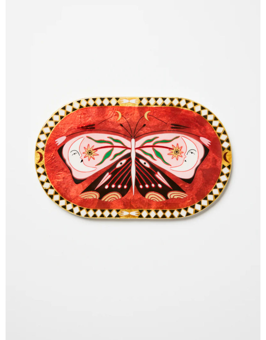Pink oval wall decor featuring a butterfly design by Jones & Co, ideal for enhancing interior spaces with elegant art.