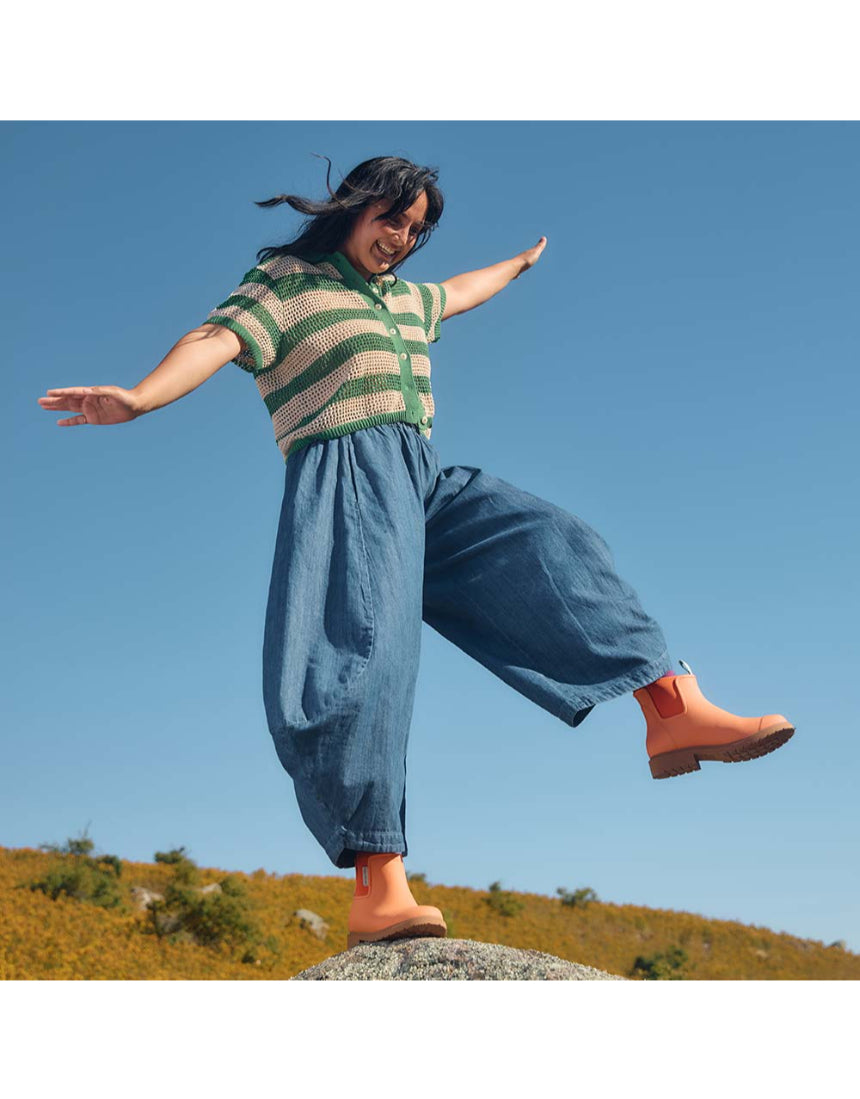 Merry People Bobbi Gumboots in Sherbet Orange, casual outdoor footwear with waterproof rubber construction and vibrant color.
