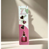 Grace & James Watermelon & Mint Heart Felt Air Freshener hanging with a pink heart shape and fresh mint and watermelon scent design