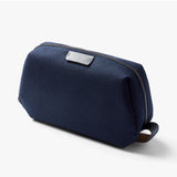 Bellroy Toiletry Kit in navy with zipper closure and multiple compartments for organizing personal grooming essentials.