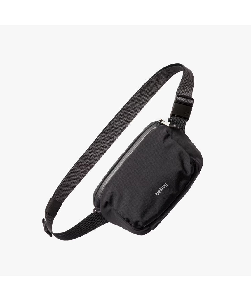 Bellroy Lite Belt Bag in black showing its compact design with adjustable strap and front pocket for everyday essentials.