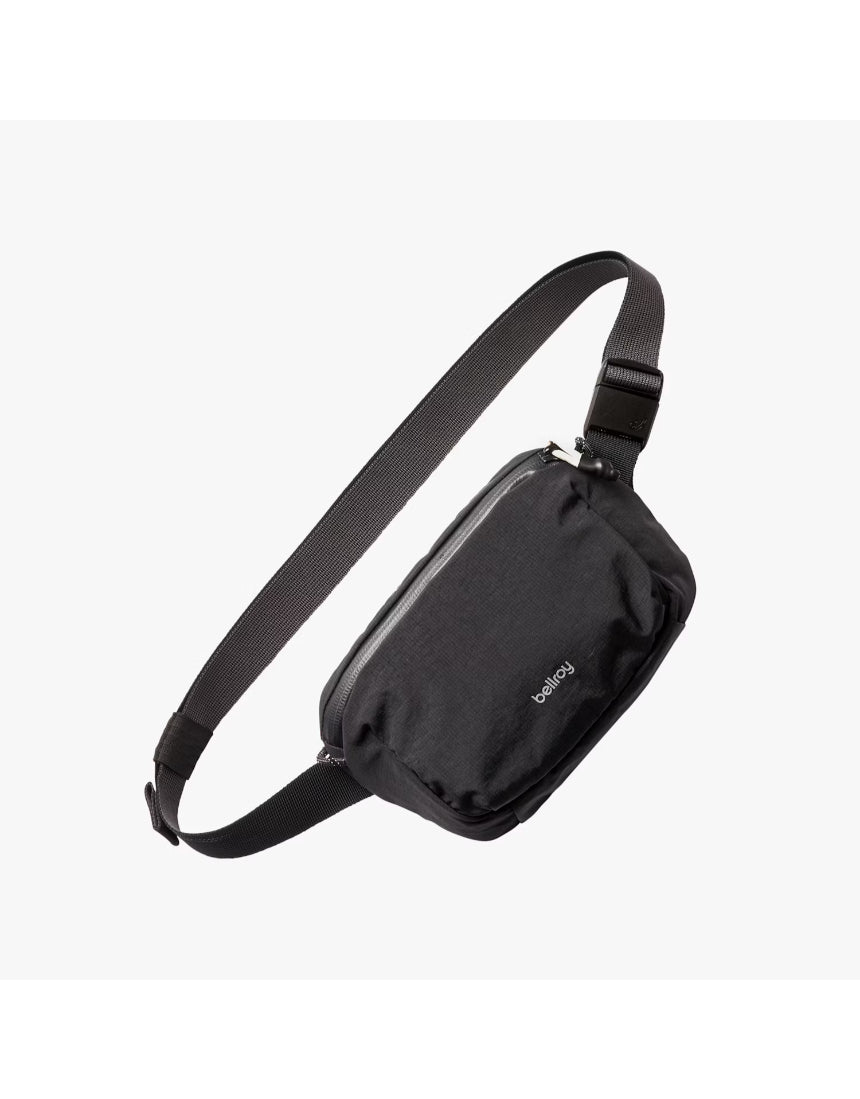 Bellroy Lite Belt Bag in black showing its compact design with adjustable strap and front pocket for everyday essentials.