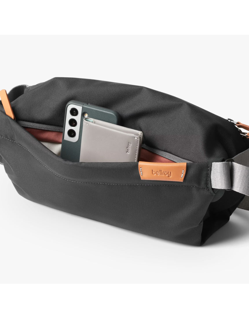 Bellroy Sling Bag in slate color with adjustable strap, compact design, and multiple compartments for everyday organization.