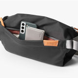 Bellroy Sling Bag in slate color with adjustable strap, compact design, and multiple compartments for everyday organization.