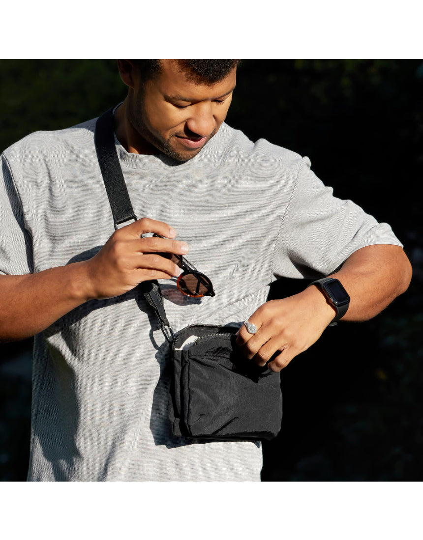 Bellroy Tokyo Side Bag in Raven, a sleek black crossbody bag with adjustable strap and multiple compartments for everyday use.