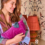 Kip & Co Wild Grape velvet toiletry bag with zipper closure, soft textured fabric, and compact accessory design.