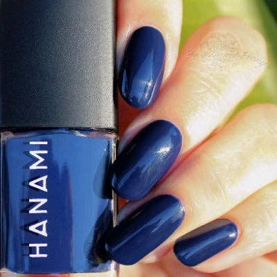 Hanami Cosmetics Hanami Ophelia nail polish bottle with deep violet color and elegant packaging on a white background.