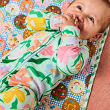 Kip & Co Cheer Up baby change mat with colorful, patterned fabric and padded surface for comfortable diaper changes.
