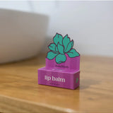 Bloom & Body caramel lip balm in a sleek tube, showcasing smooth, moisturizing balm with caramel scent and branding.