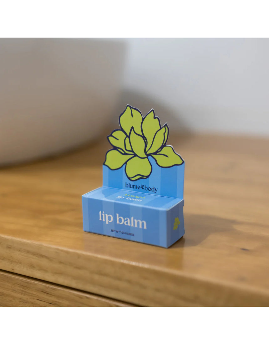 Bloom & Body Mango Lip Balm tube with bright packaging, showcasing smooth, nourishing mango-flavored lip balm.