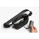 Bellroy Lite Belt Bag in black with adjustable strap and compact design, perfect for carrying essentials stylishly.