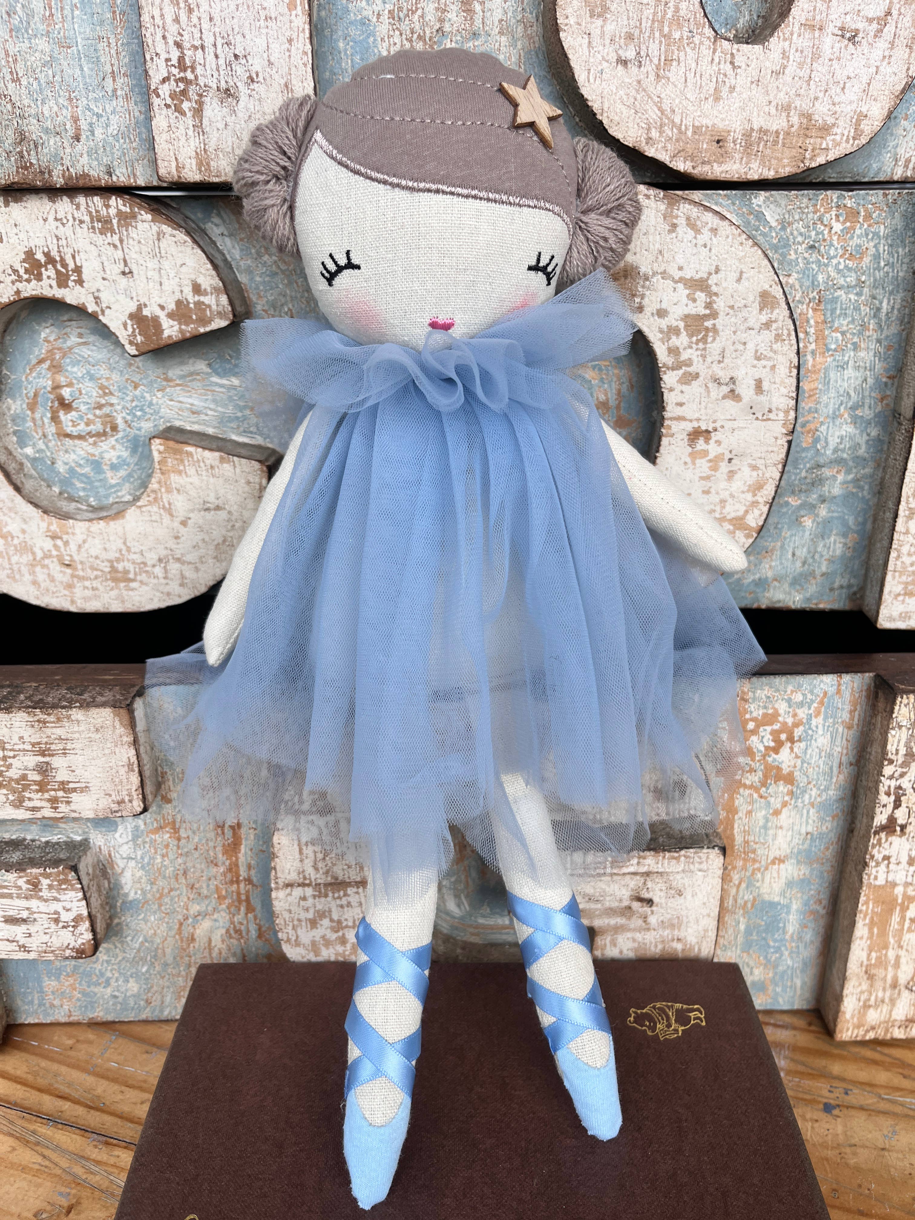 Amaranta Designs ballerina doll with a pink tutu, ballet shoes, and detailed facial features, dressed in a graceful ballet pose.