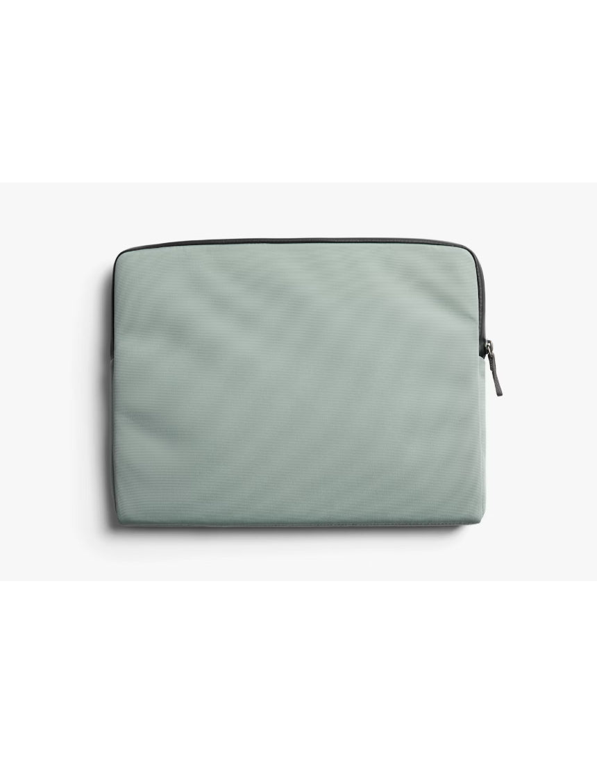 Bellroy 14-inch Laptop Caddy in Eucalyptus with multiple compartments for organizing laptop accessories and cords.