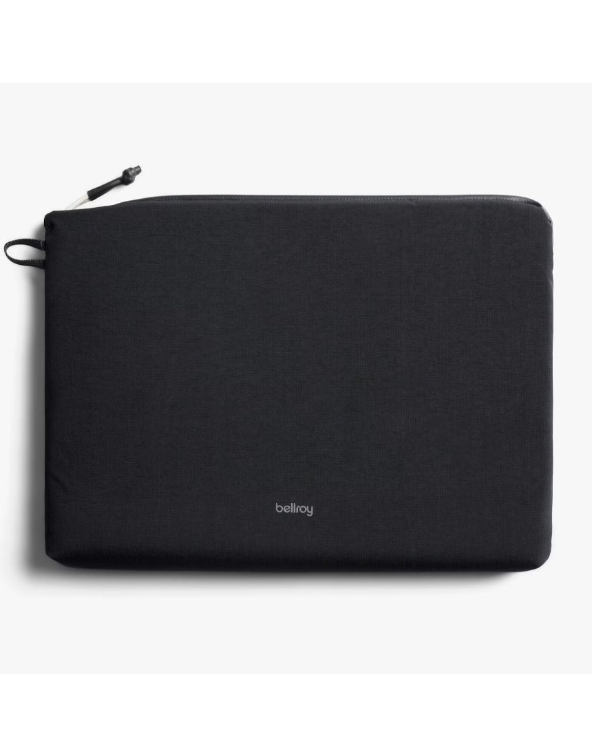 Black Bellroy Lite Laptop Sleeve for 16-inch laptops, slim design with smooth exterior and padded interior for protection.
