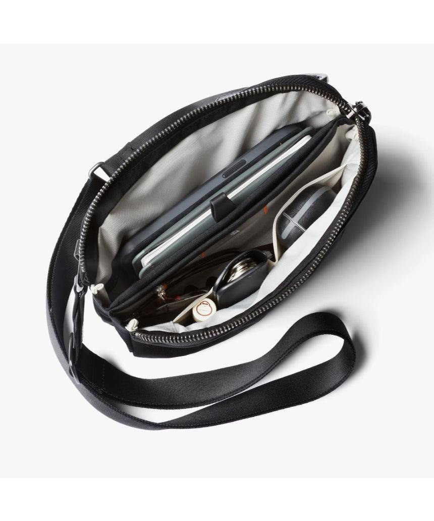 Bellroy Tokyo Side Bag in Raven, a sleek black crossbody bag with adjustable strap and compact design for everyday use.