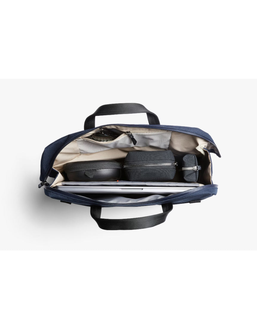 Bellroy Via Work Bag in navy, sleek leather briefcase with handles, front pocket, and adjustable shoulder strap for professional use.