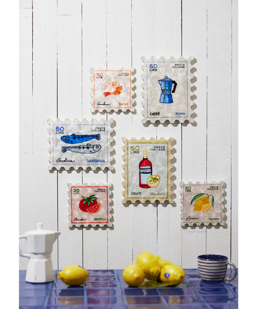 Jones & Co Pomodoro Stamp wall decor featuring a vintage-style circular design with bold red and white accents.