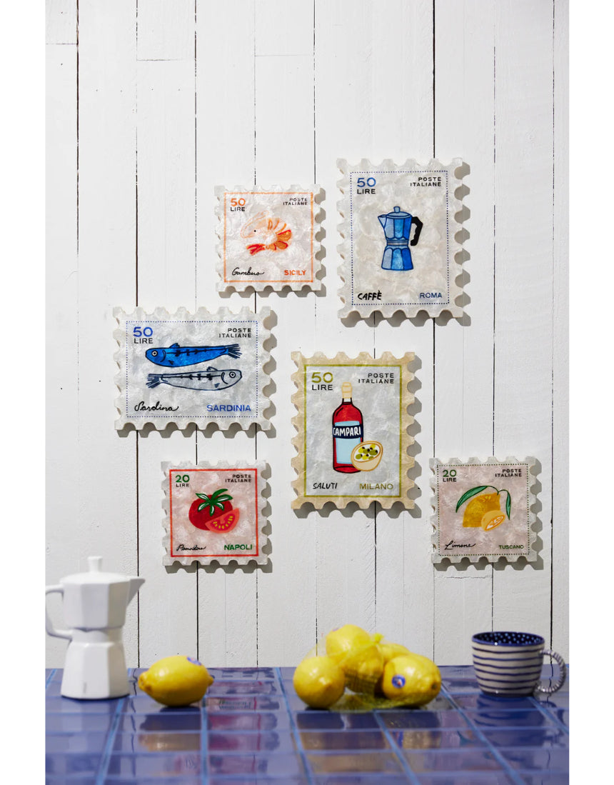 Jones & Co Pomodoro Stamp wall decor featuring a vintage-style circular design with bold red and white accents.