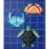 Jones & Co Beach Club Turtle wall art in green, vibrant decorative wall decor featuring a stylized turtle design.