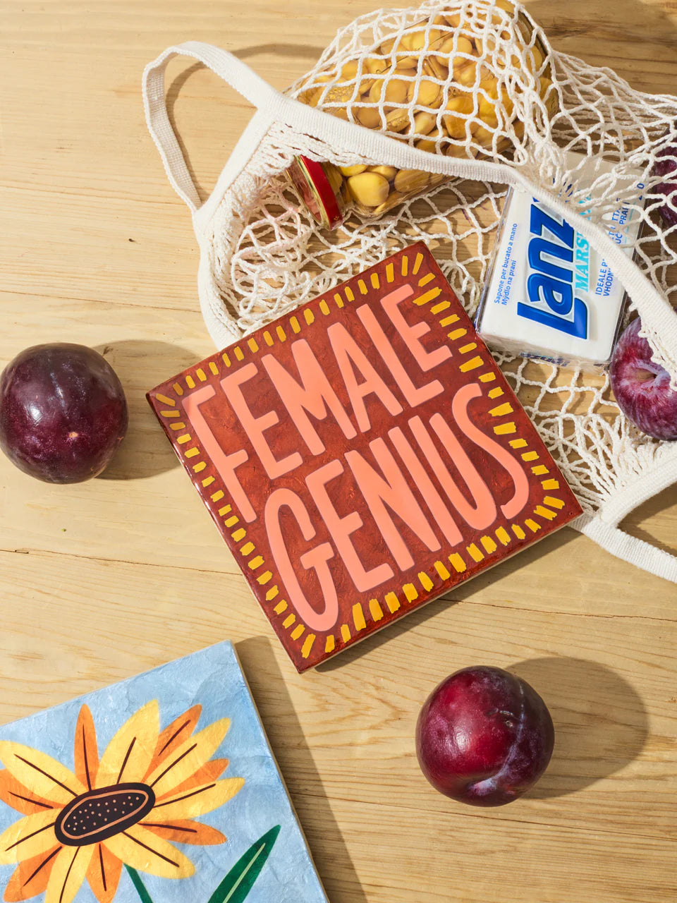 Jones & Co Superette Genius Tile wall decor featuring colorful geometric patterns on ceramic surface.