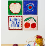 Jones & Co Superette Apple Tile wall decor featuring a vibrant, colorful apple design on a textured ceramic tile.