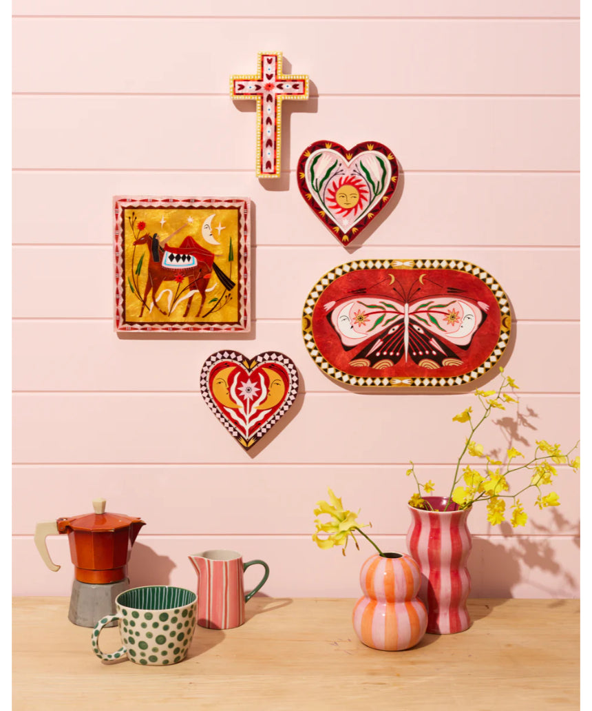 Jones & Co Fable Butterfly Pink Oval wall decor featuring a delicate pink butterfly design on an oval background.