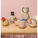 Jones & Co Samira vase filled with colorful flowers, showcasing a stylish decorative glass vase on a neutral background.
