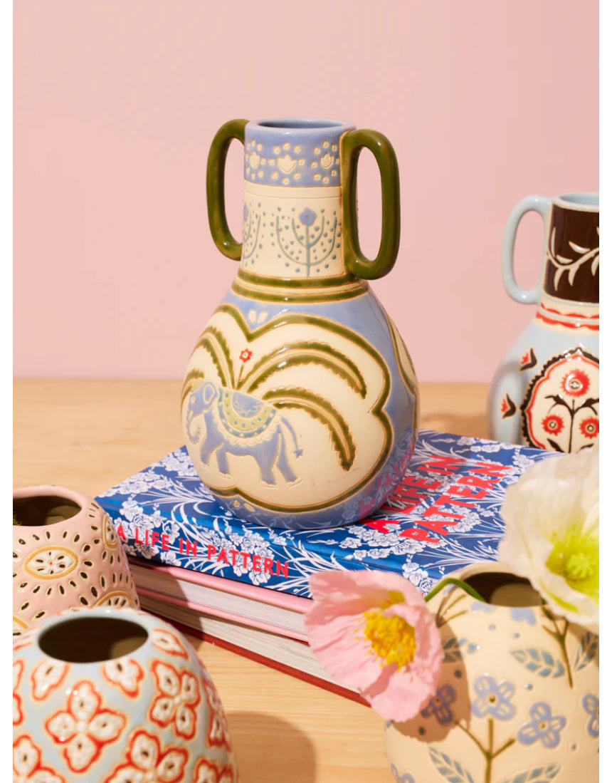 Jones & Co Samira Elephant Vase, decorative ceramic vase with elephant design, showcasing intricate details and a smooth finish.
